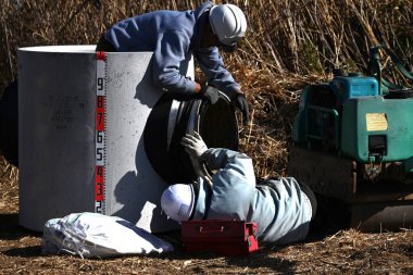 Sewer pipe installation work. Sewers support a safe and comfortable life by purifying wastewater and preventing damage from heavy rains. clipart