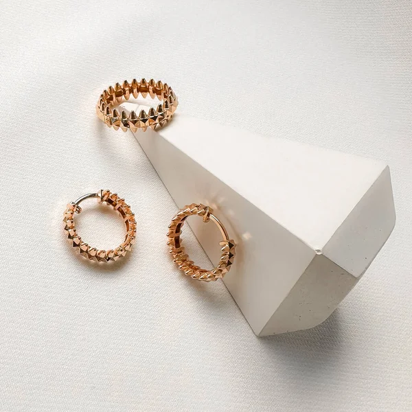 Earrings and ring in 14k pink gold with spikes designed to be worn together.