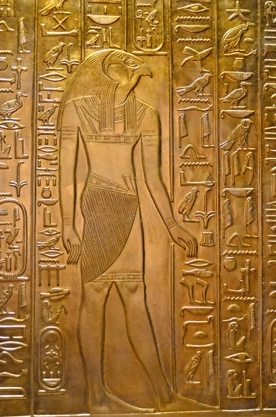 Ancient Egyptian engraving on a sheet of gold of the God Horus, divine son of Osiris and Isis, the sky God  with eyes of the sun and the moon
