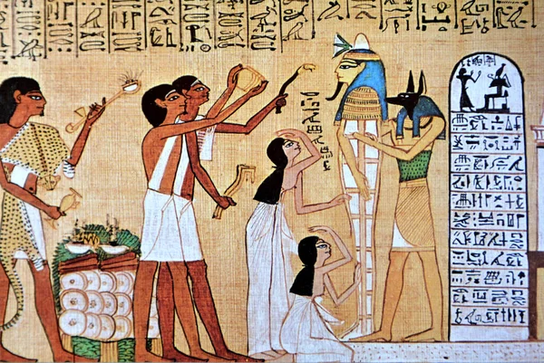Ancient Egyptian Papyrus showing the opening of the mouth ceremony. Priest with incense and accolytes prepare the opening. Wife and daughter in mourning, Mummy in the arms of Anubis