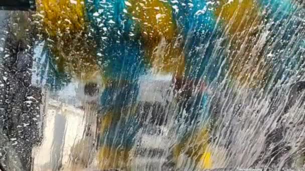 Automatic Car Wash Seen Back Vehicle Moving Machine Colorful Rollers — Stock Video