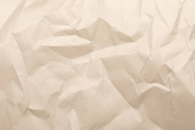 Sheet of brown wrinkled kraft made from recycled paper with texture and details