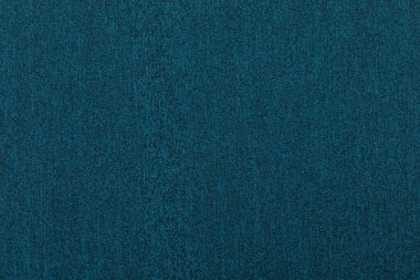 Dark blue-green melange knitted fabric textured background