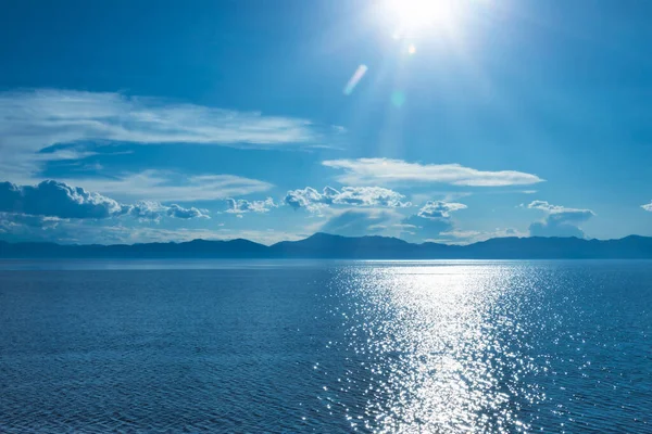 Stock image Sunlight glittering on the blue water of Khovsgol Lake, the largest freshwater lake in Mongolia on a bright summer day