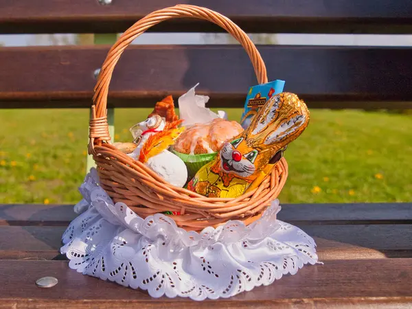 Easter basket.   Lodz, Poland - April 19, 2014   Decorated according to Polish Easter tradition, a basket with food, fruit and a chocolate bunny.