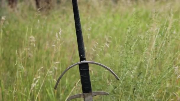 Smooth Camera Movement Selective Focus Two Handed Sword Stuck Ground — Video Stock