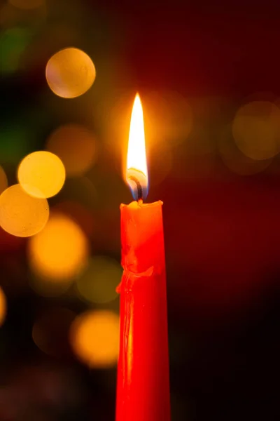 Close Red Burning Candle Dark Bokeh Background Christmas Tree — Stock fotografie