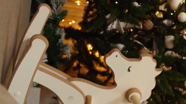Vertical Video Children Wooden Rocking Horse Background Christmas Tree Smooth — Stock Video