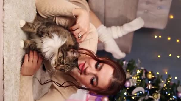 Young Woman Gray Tabby Cat Lie Carpet Background Christmas Tree — Stock Video