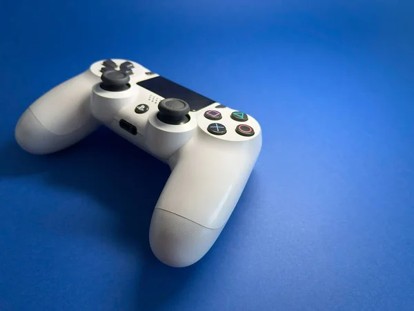 stock image White PS4 controller on the color background