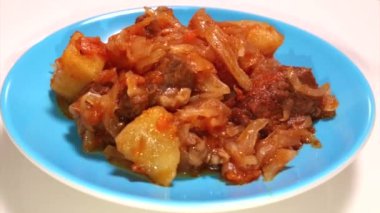 Bigos, braised beef with cabbage and potato, rotating video