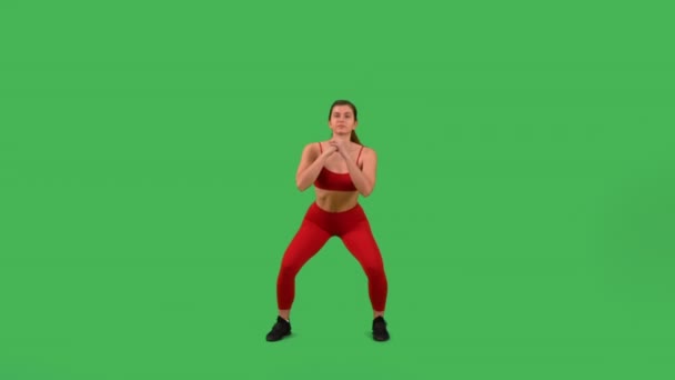 Sporty Woman Doing Exercise Side Step Out Squat Isolated Green — Vídeos de Stock