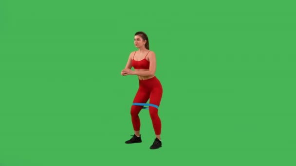 Sporty Woman Doing Squat Resistance Bands Dressed Red Top Sports — Vídeo de Stock