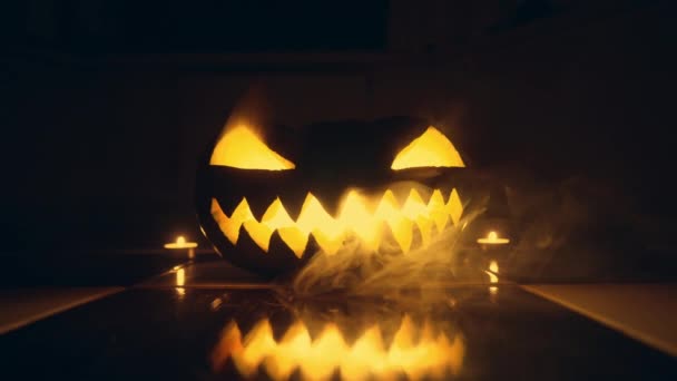 Pumpkin Lit Candle Showcasing Its Carved Open Mouth Stands Out Royalty Free Stock Footage