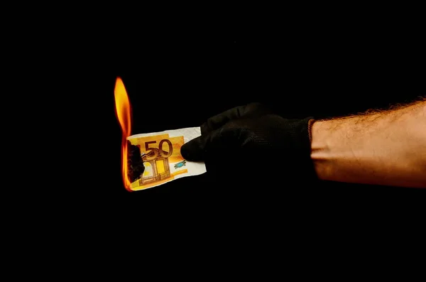 burning European Euro Money Banknote Currency  in  Hand