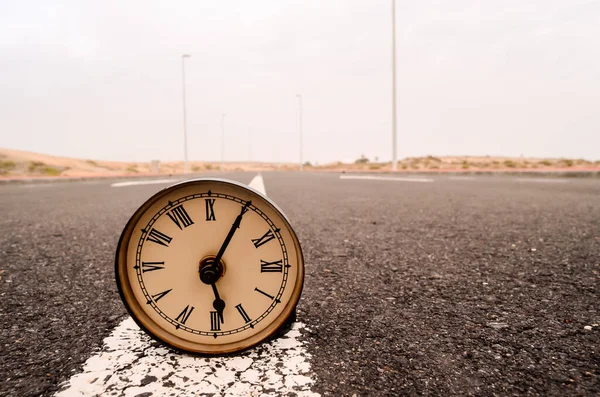 stock image Time Concept Alarm Clock on the Asphalt Street