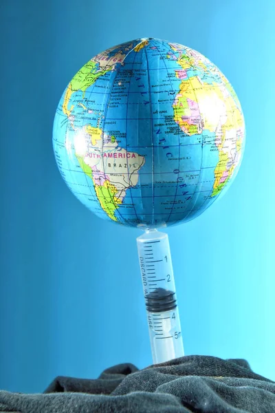 Biological hazard. The syringe and the globe.