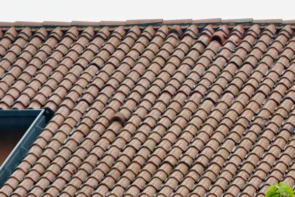 old roof tiles with brown and red tiled roofing