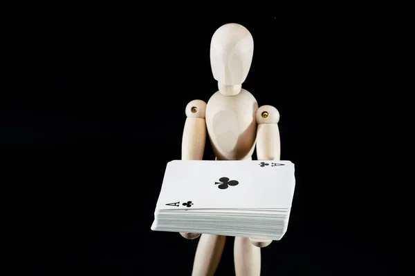 wooden dummy, puppet made of wood, art mannequin with playing cards