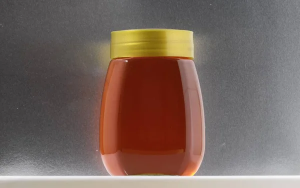 Isolated One Full Honey Jar — стоковое фото