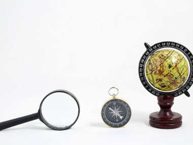 Vintage Tools Globe Compass and Loupe on a White Background clipart