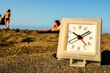 Photo Picture of a Clock on the Sand Beach clipart