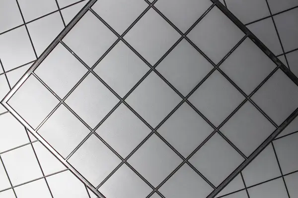 Ceiling design made up of distorted geometric patterns