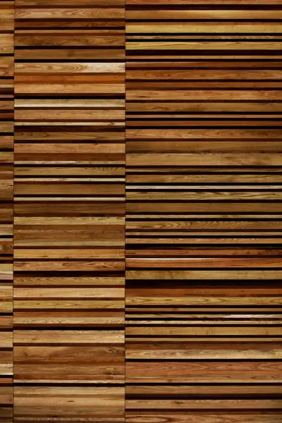 stock image A close-up photo for background material of a wall made of many layers of long thin boards