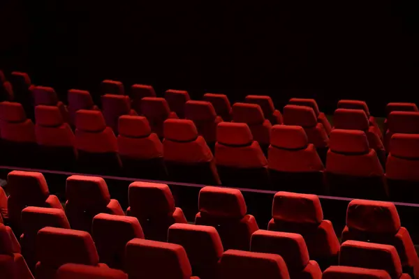 stock image Red seats lined up in the theater