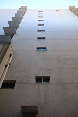 Background material photo of a close-up of a concrete warehouse wall clipart