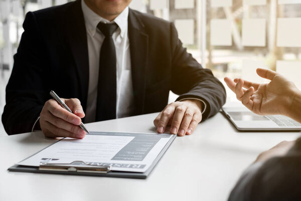 Interviewers and job applicants are talking about the information on the resume in the office, Job applications concepts.