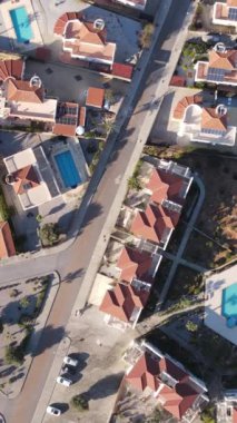 Drone view of the famous holiday sites of Cyprus, tourist hotels built for summer holidays, swimming pools and buildings in green nature