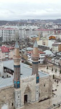 The view of the historical sky madrasah in the settlement of the city, the double minaret Seljuk structure in Sivas, historical monuments of Sivas cityscape