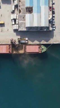 Aerial drone view of Famagusta city port, anchorage of cargo ship, colored containers in the port, city ports for maritime trade in TRNC