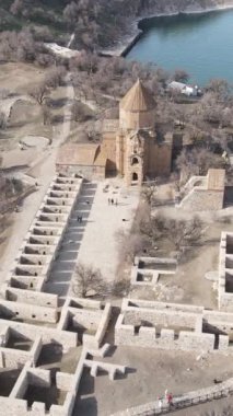 Drone view of the historical island established on the island, drone view of Akdamar church, historical building ruins and armenian church on Turkey