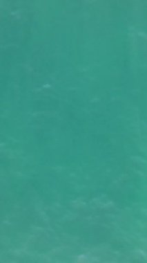 Aerial drone view of turquoise sea waves, sea waves shining with sunlight, view of clear beautiful waves in the sea, turquoise background image
