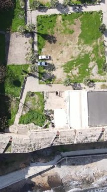 Inside the walls of the historical castle built by the sea, Kyrenia castle taken by drone from the air, Girne protected by the castle walls