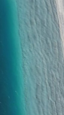 Aerial drone footage of volcanic lake salda, famous crater lake salda with water waves and white beach, tectonic lake regions in Turkey