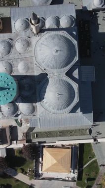 Drone view of historical places of konya from the air, drone view of sultan selim mosque and Mevlana museum, domes of historical mevlana tomb buildings