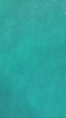 Aerial drone view of turquoise sea waves, sea waves shining with sunlight, view of clear beautiful waves in the sea, turquoise background image