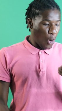 Encounter surprises on phone, to be happy when you see a good news while looking at the phone, show body language and facial expressions in front of a green screen