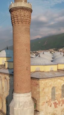 Bursa grand mosque architecture, architectural structure of islamic place of worship with minarets and domes, touristic important mosque made of stone