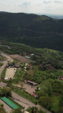 Village In Green Forest, village full of greenery perched on the summit of the mountains, green countryside view, resorts used for rural holidays