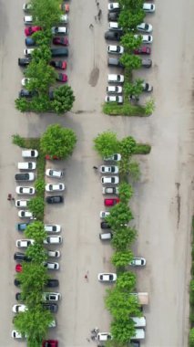 Aerial public parking lot, vehicle parking lot, vehicle parking system of botanical park drone image, image of parking area during weekend holidays