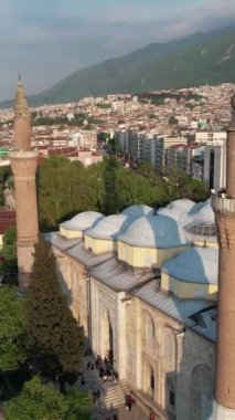Aerial bursa ulucami minaret, historical texture structures settled in the city of Bursa, touristic islamic monuments of turkey