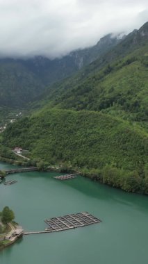 Aerial drone view of river neretva flowing through mountains view of fertile river feeding jablanica view of river flowing through green forest in Bosnia and Herzegovina clipart