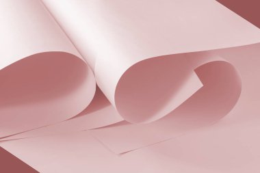Yaratıcı tasarım görevleri için bir arkaplan olarak pembe kağıt sayfaları.