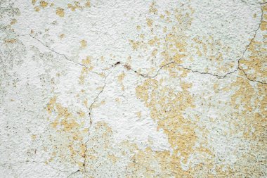 Parçalanmış alçı ve duvardaki boya soyut bir arkaplan gibi..