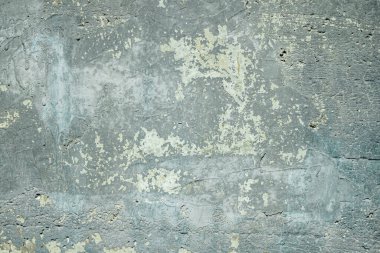 Arka plan olarak beton duvardaki pürüzlü alçı dokusu.