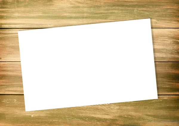 Empty white list on an old style wooden empty background, top wiev